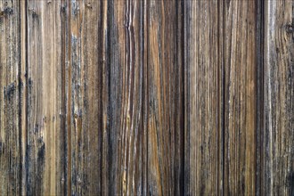Old weathered wooden boards on wooden wall