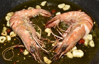 King prawns with garlic and chili in a pan