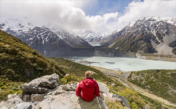 Hiker sitting on rocks