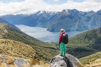 Female hiker looking at the South Fiord of Lake Te Anau