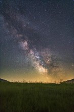 Milky Way over meadow