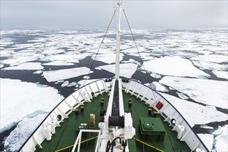 Expedition Boat navigating through melting pack ice