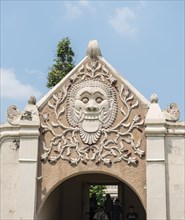 Relief of a grimace of an archway