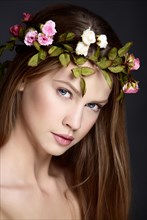 Young woman with wreath of flowers