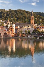 View over the Neckar River of Church of the Holy Spirit with Karl Theodor Bridge and Bridge Gate in Heidelberg