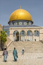 Tourists on a square in front of the Dome of the Rock