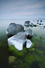 Coastline with big boulders on beach