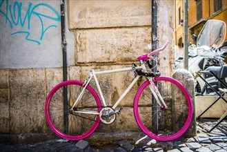 Old pink bike without saddle