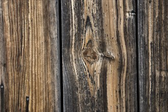 Old weathered wooden boards on wooden wall