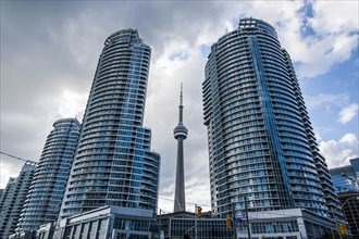 CN Tower behind high rise buildings