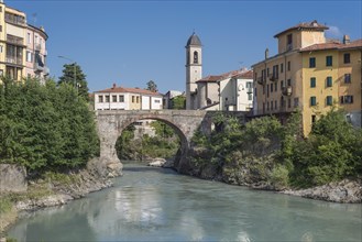 Old Roman bridge Ponte Vecchio over the river Dora Baltea