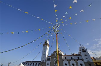 Colorful pennants at a festival in front of the Basilica de Nuestra Senora