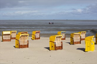 Beach chairs on sandy beach