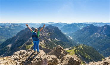 Hiker with views of mountains and Alps