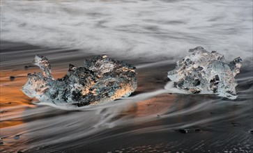 Ice, chunks of ice on lava beach near Jokulsarlon