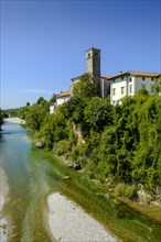 View over the river Natisone to the Campanile of the cathedral Santa Maria Assunta and the old town