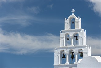 Bell tower in front of cloudy sky