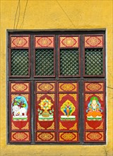 Traditional Buddhist motifs on wall