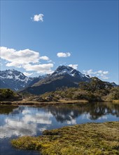 Small mountain lake with reflection