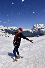 Asian woman enjoying the snow in the mountains