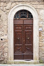 Wood door with carved motifs