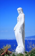 Statue of the Virgin Mary above the sea