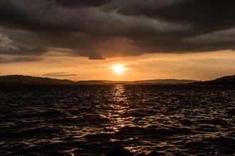 Sunset with clouds and stormy mood