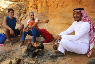 Tourists drink Tea with Bedouin in Wadi Rum