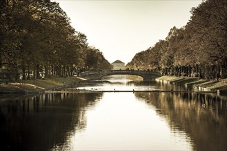 East side of Nymphenburg Palace in autumn with lock channel