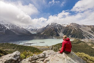 Hiker sitting on rocks