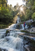 Hiker at McLean waterfall