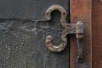 Rusty hinge on old door