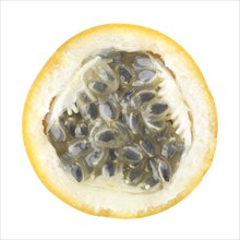Sliced ripe yellow passion fruit showing seeds inside