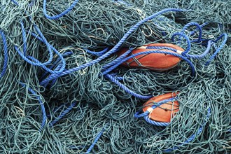 Green fishing nets with red floats