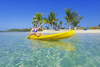 Woman in yellow kayak