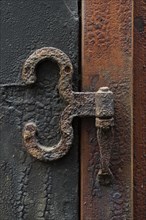 Rusty hinge on old door