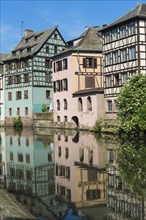 Timbered Houses reflecting in the ILL canal along the Quai de la Petite France