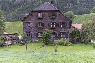 Old farmhouse with shingle facade