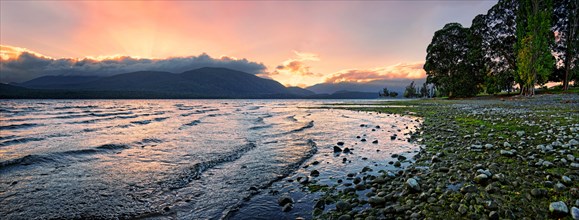 Shore of Lake Te Anau at sunset