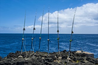 Angling rods on a rock at The Sea