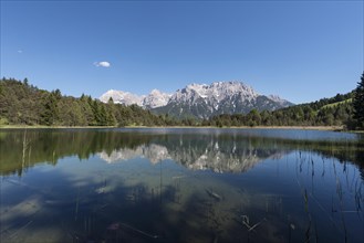 Western Karwendelspitze is reflected in the Luttensee