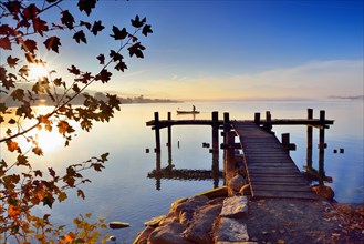 Wooden footbridge at the Lake Pfaffikersee at sunrise