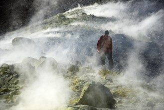 Hiker on the Gran Cratere walks through sulphur fumaroles