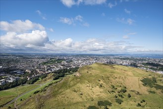 View across cliffs of Salisbury Crags into city of Edinburgh from Arthur's Seat
