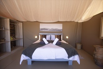 Double bed in luxury tent