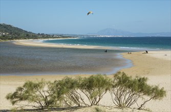 Sandy beach with hang glider at Bay of Valdevaqueros