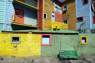 Colorfully painted houses made of corrugated sheet iron
