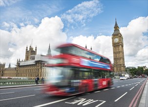 Red double-decker bus on the Westminster Bridge
