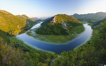 River bend of the river Rijeka Crnojevica in the evening light