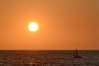 Sailboat at sunset over the North Sea